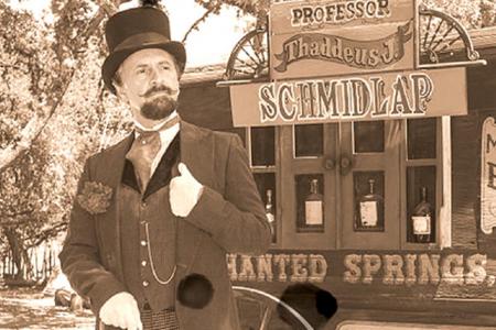 "Professor Thaddeus Schmidlap" (historical intrepreter Ross Nelson), the resident snake-oil salesman at the Enchanted Springs Ranch. (Public Domain)