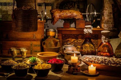 Medieval ancient kitchen table with typical food in wealthy home. (Nejron Photo/Adobe Stock)